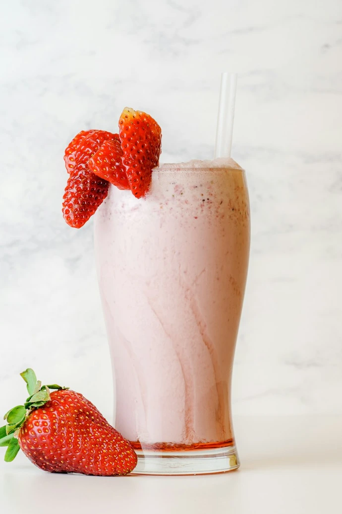 strawberry shake in clear drinking glass
